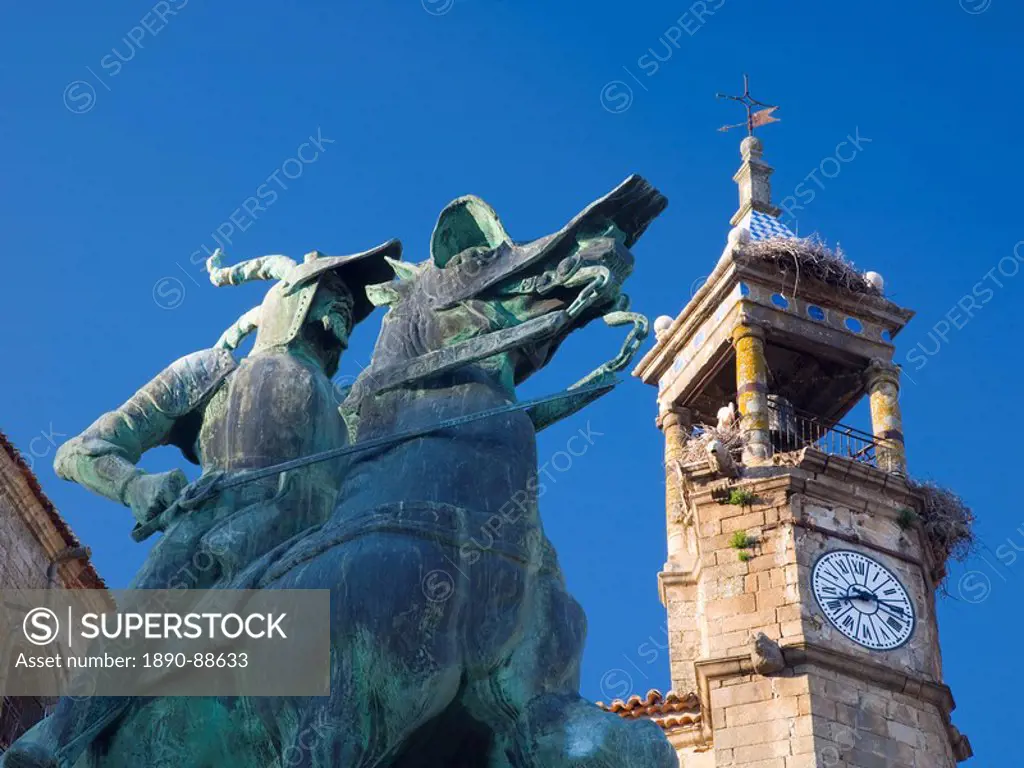 Equestrian statue of Francisco Pizarro in the Plaza Mayor, clock_tower of the Iglesia de San Martin beyond, Trujillo, Caceres, Extremadura, Spain, Eur...