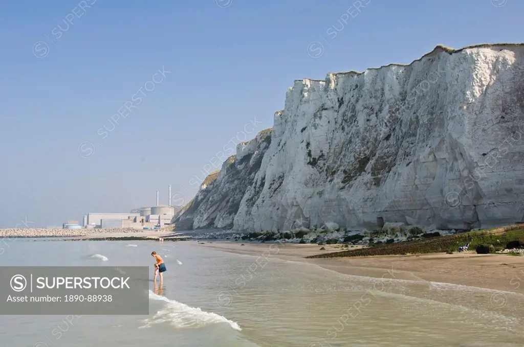 A beach under the chalk cliffs, mother and child paddling, Nuclear Power Station in the background, near Dieppe, Seine Maritime, Normandy, France, Eur...