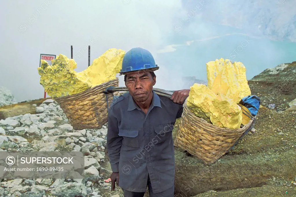 Man engaged in sulphur mining, a back_breaking and dangerous job in the Kawah Ijen Crater, Ijen Volcano, East Java, Indonesia, Southeast Asia, Asia