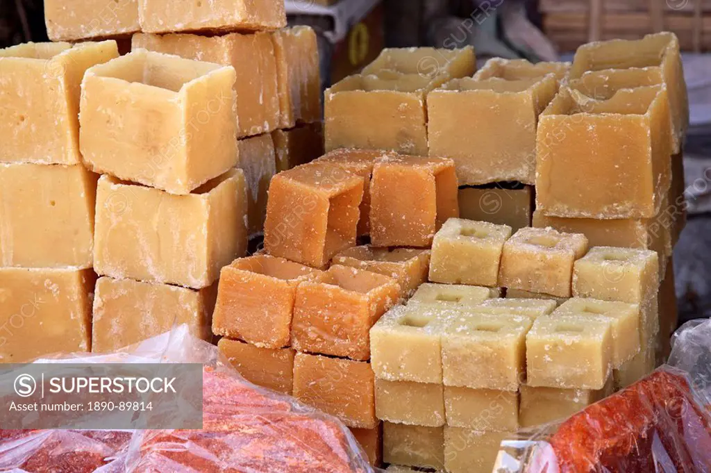 Jaggery, sugar cubes in the market in Mysore, India, Asia