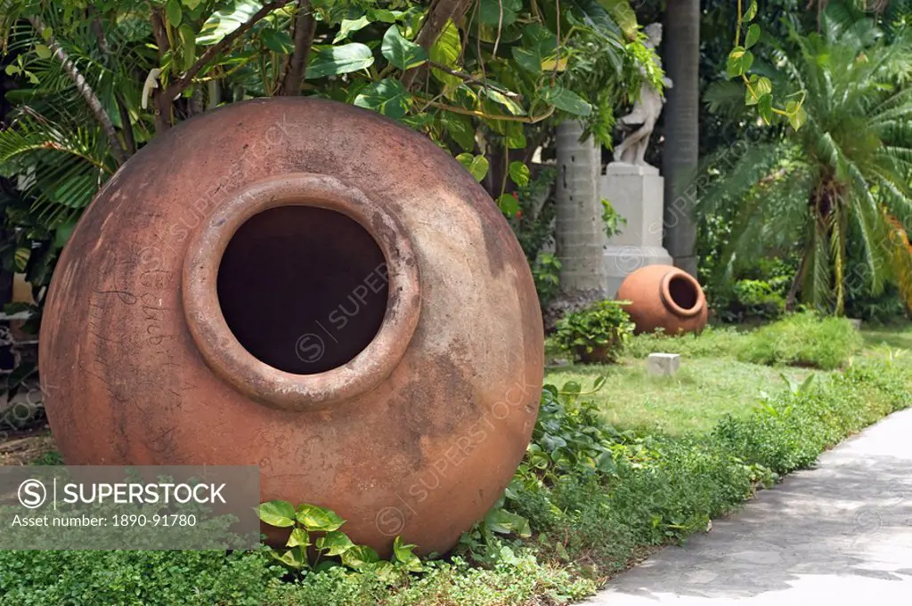Dated 1856, these clay jars called tinajones were used for storing liquids and foods, now lying in the gardens of what was originally the villa of Jos...