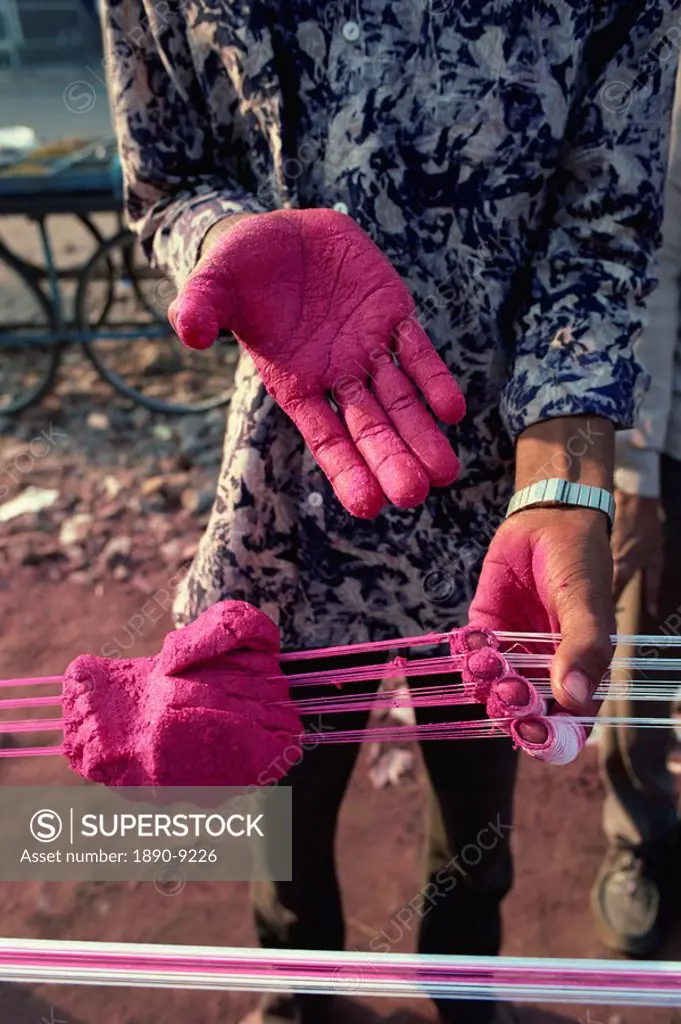 Kite string production, string is coated in ground glass for fighting kite  festival in January, Ahmedabad, Gujarat state, India, Asia - SuperStock