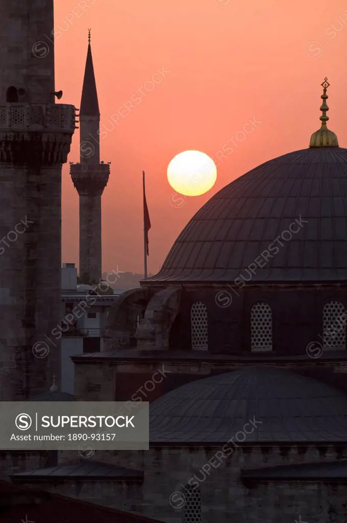 Sun setting behind Mahamut Pasha Mosque, Istanbul, Turkey, Europe