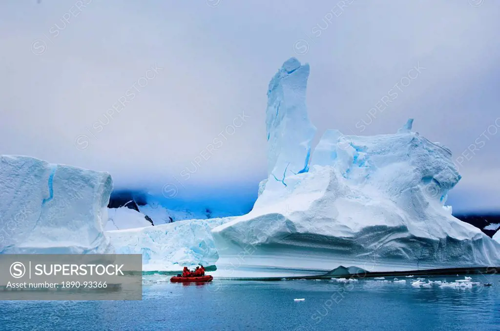 Passengers exploring icebergs near Pleneau Island, Antarctica, Polar Regions