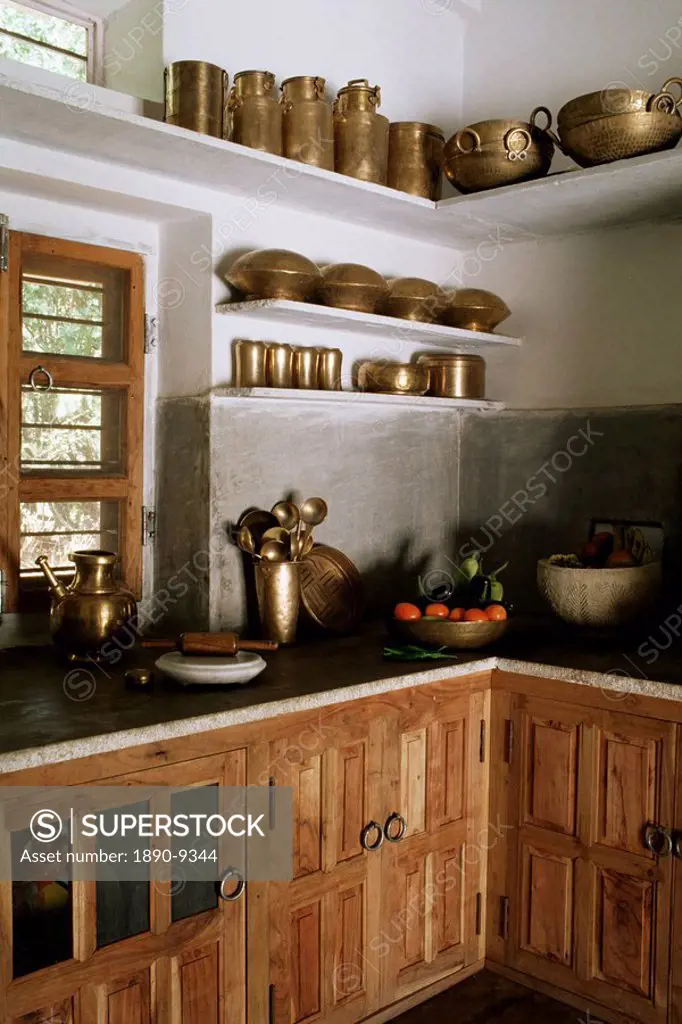 Traditional brass kitchen utensils in kitchen area in residential home, Amber, near Jaipur, Rajasthan state, India, Asia