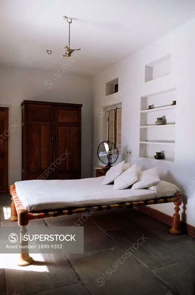 Bedroom with traditional low slung bed or charpoy in a home in Amber, near Jaipur, Rajasthan state, India, Asia
