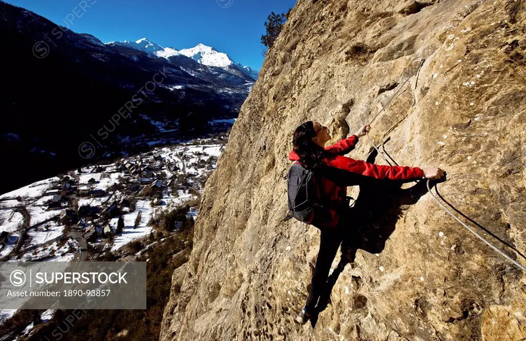 Climbing a via ferrata course near Vallouise, Ecrins Massif, France, Europe