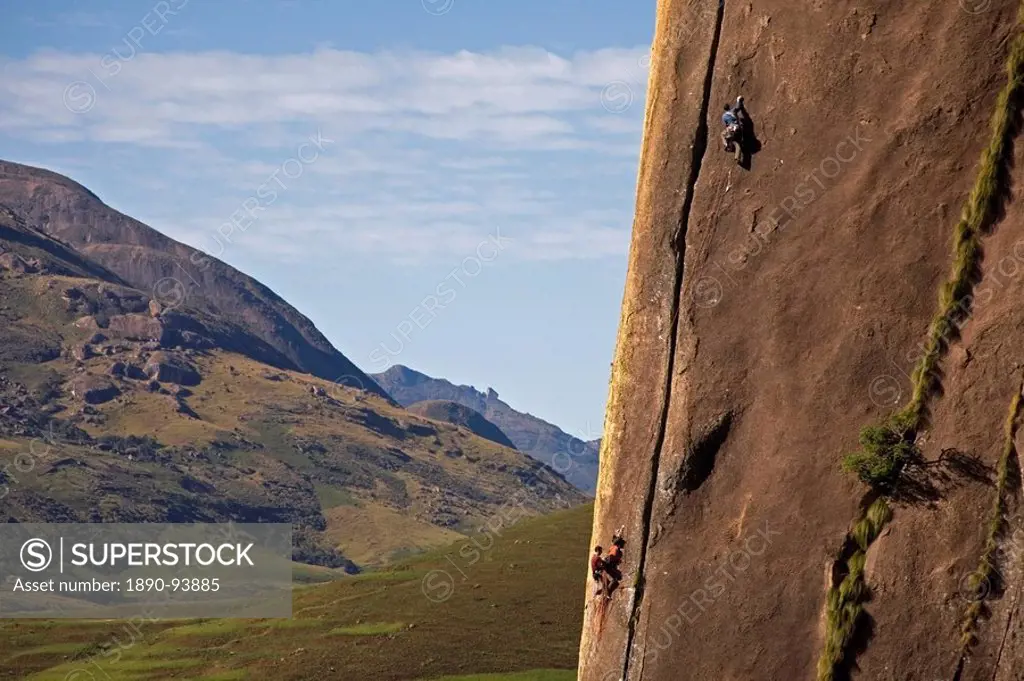 Two rock climbers making their way up a very difficult route on the 450 metre monolith of Karimbony, Tsaranoro Massif, Andringitra National Park, Sout...