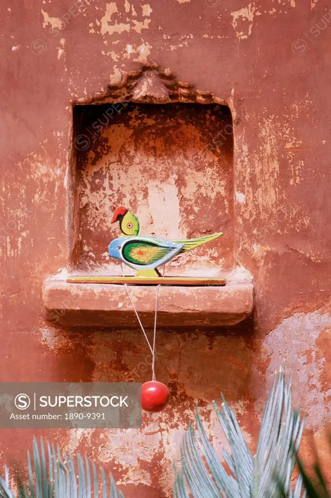 Decorative child´s toy parrot in traditional wall niche, restored traditional Pol house, Ahmedabad, Gujarat state, India, Asia