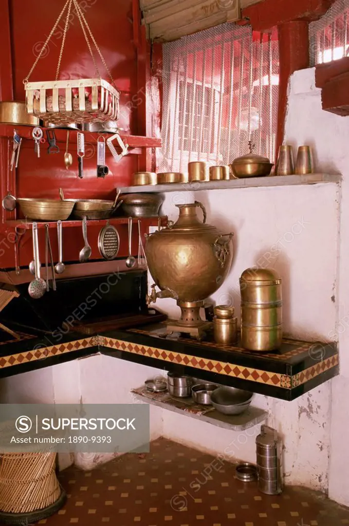 Kitchen area with traditional brass cooking utensils and samovar in restored traditional Pol house, Ahmedabad, Gujarat state, India, Asia