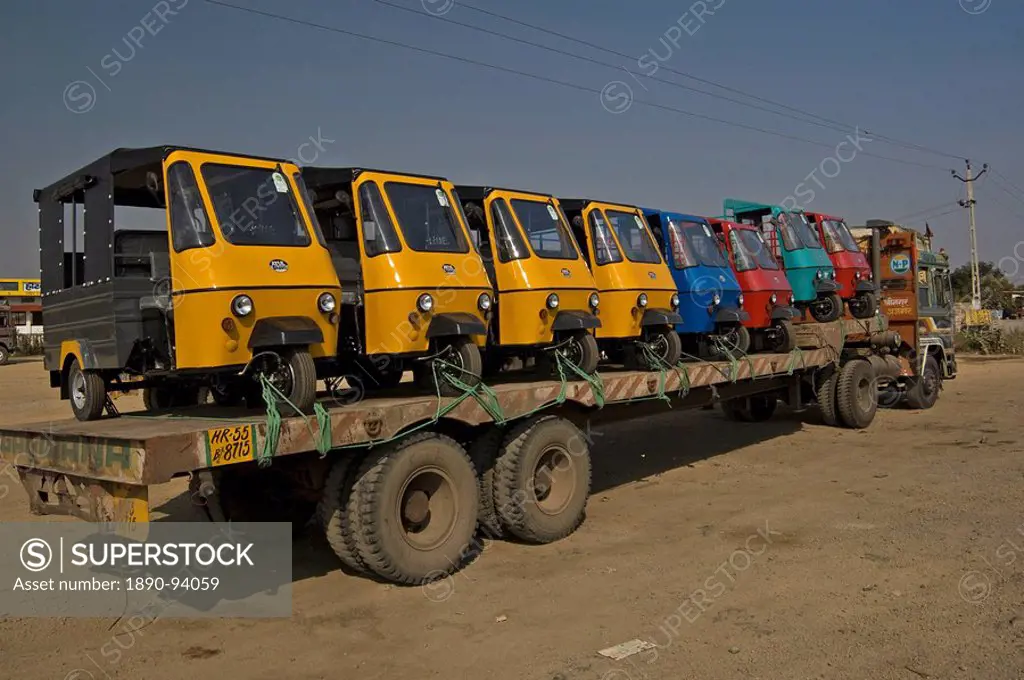 New tuc tuc rickshaws being transported from the factory to the city, Ajmer district, Rajasthan, India, Asia