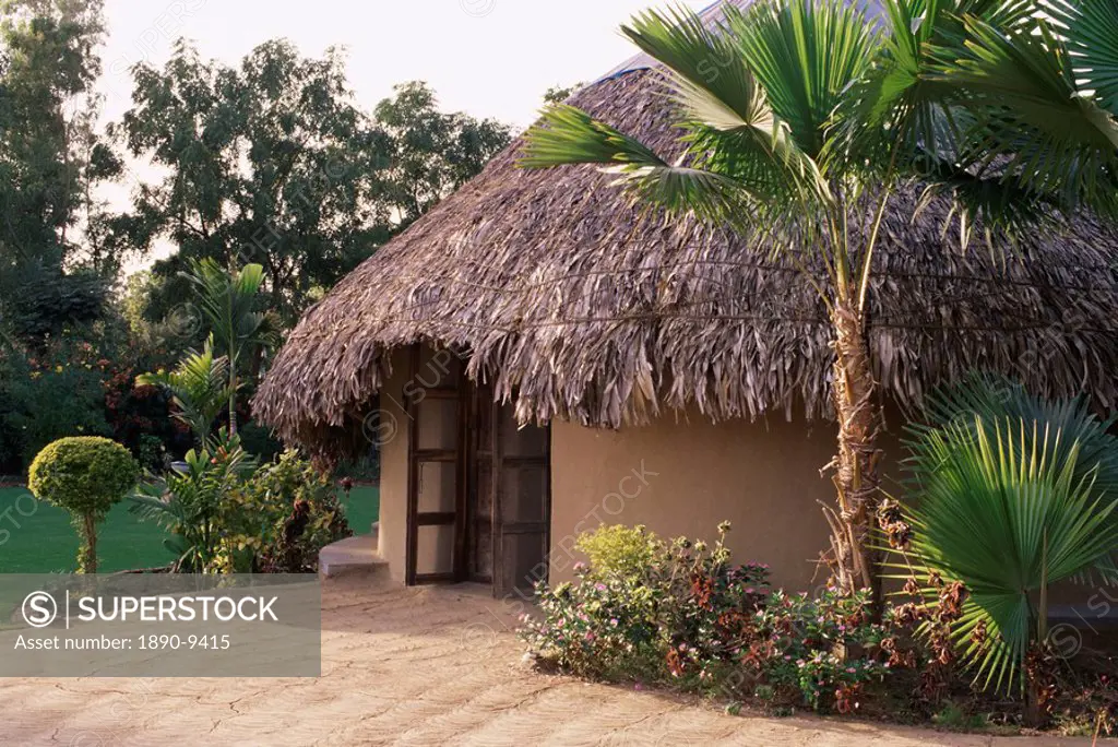 Modern residential home in traditional tribal Rabari round mud hut, Bunga style. near Ahmedabad, Gujarat state, India, Asia