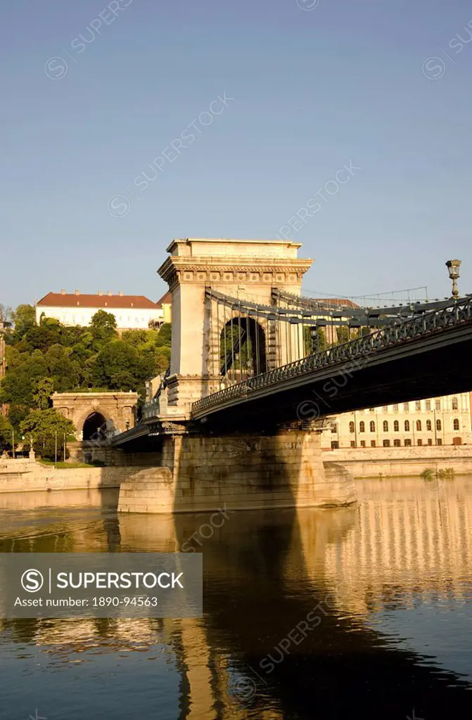 An early morning sail under the Chain Bridge on the Danube River, Budapest, Hungary, Europe