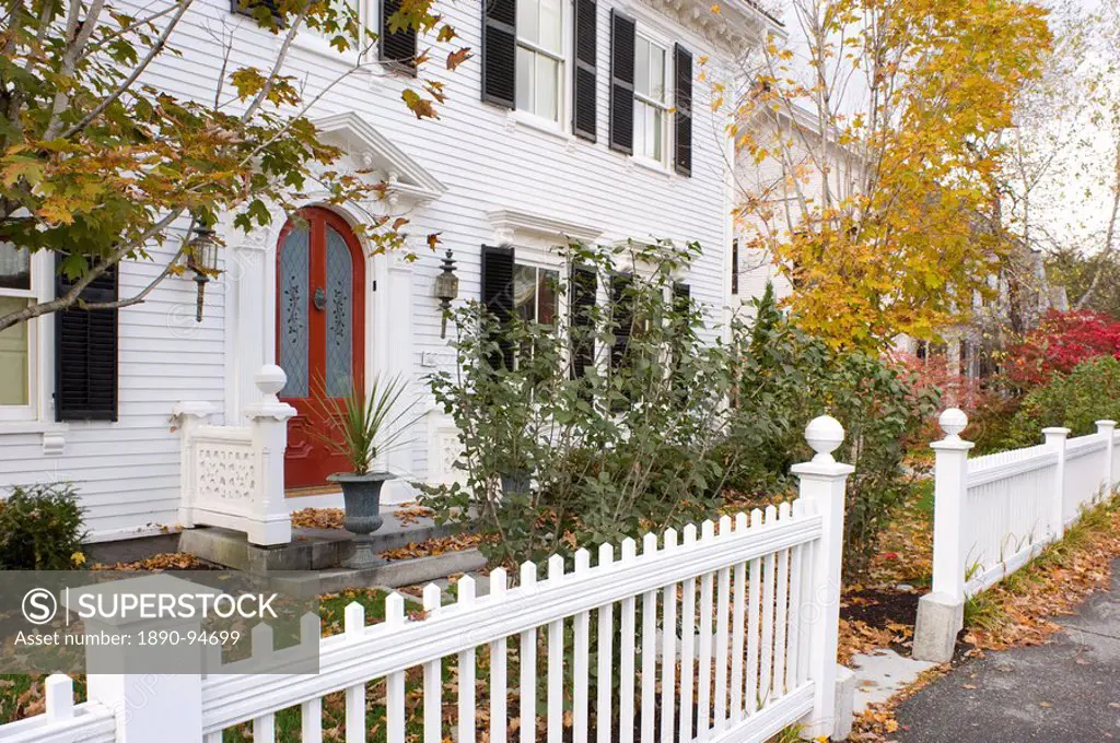 A traditional wood house and picket fence surrounded by autumn leaves in Woodstock, Vermont, New England, United States of America, North America