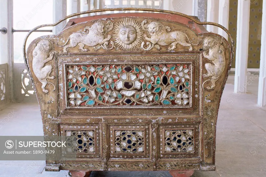 Detail of the back of an antique elephant howdah in the Grand Durbar Hall, Devi Garh Fort Palace Hotel, near Udaipur, Rajasthan state, India, Asia