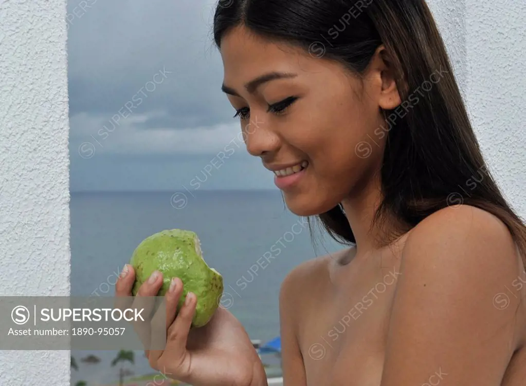 Girl with guava, Thunderbird Resort and Spa, La Union, Phillipines, Southeast Asia, Asia,,