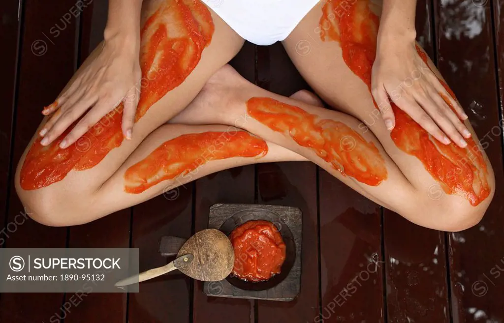 Close_up of papaya and tamarind scrub treatment on legs