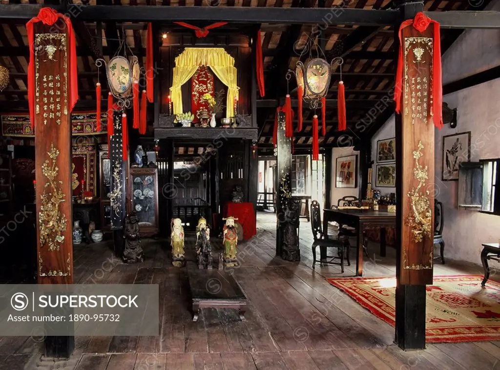 Upper floor with altars in the 18th century Phung Hung House, one of the oldest houses of Chinese traders in Hoi An, Vietnam, Indochina, Southeast Asi...