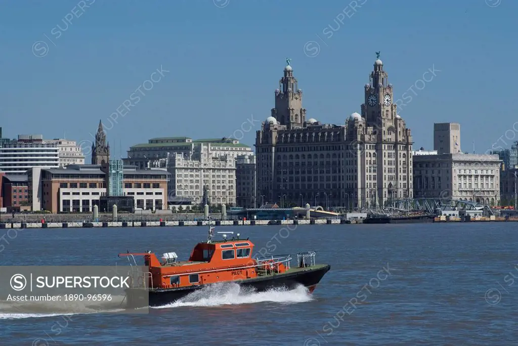 View of the Liverpool skyline and the Liver building, with a pilot boat in the foreground, taken from the Mersey ferry, Liverpool, Merseyside, England...