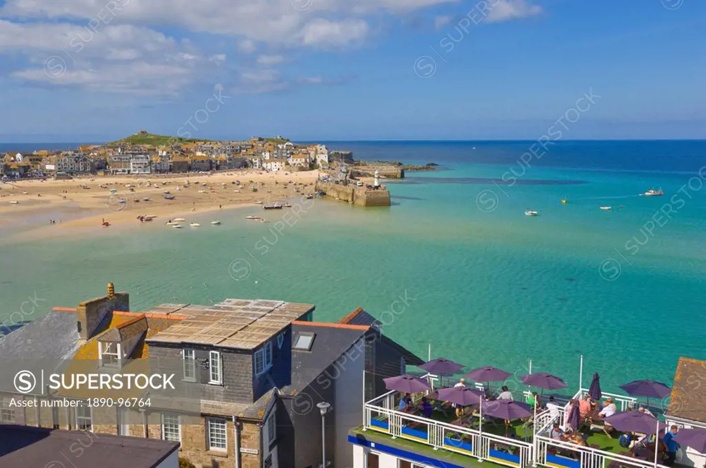 Low tide, looking over the rooftops and across the harbour at St. Ives  Pedn Olva  towards The Island or St. Ives head, North Cornwall, England, Unite...