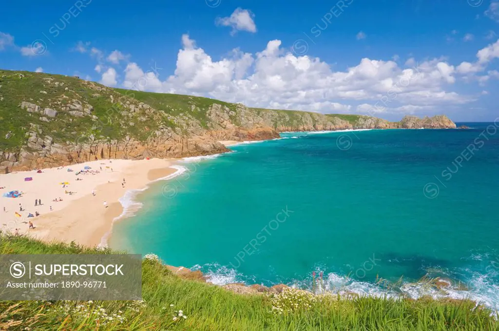 Holidaymakers and tourists sunbathing on Porthcurno beach, Cornwall, England, United Kingdom, Europe