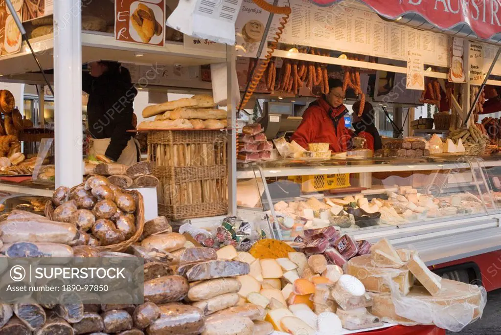 Stall selling cheese, fruit cake and sausages at Christmas Market on Maxheinhardtplatz, Salzburg, Austria, Europe
