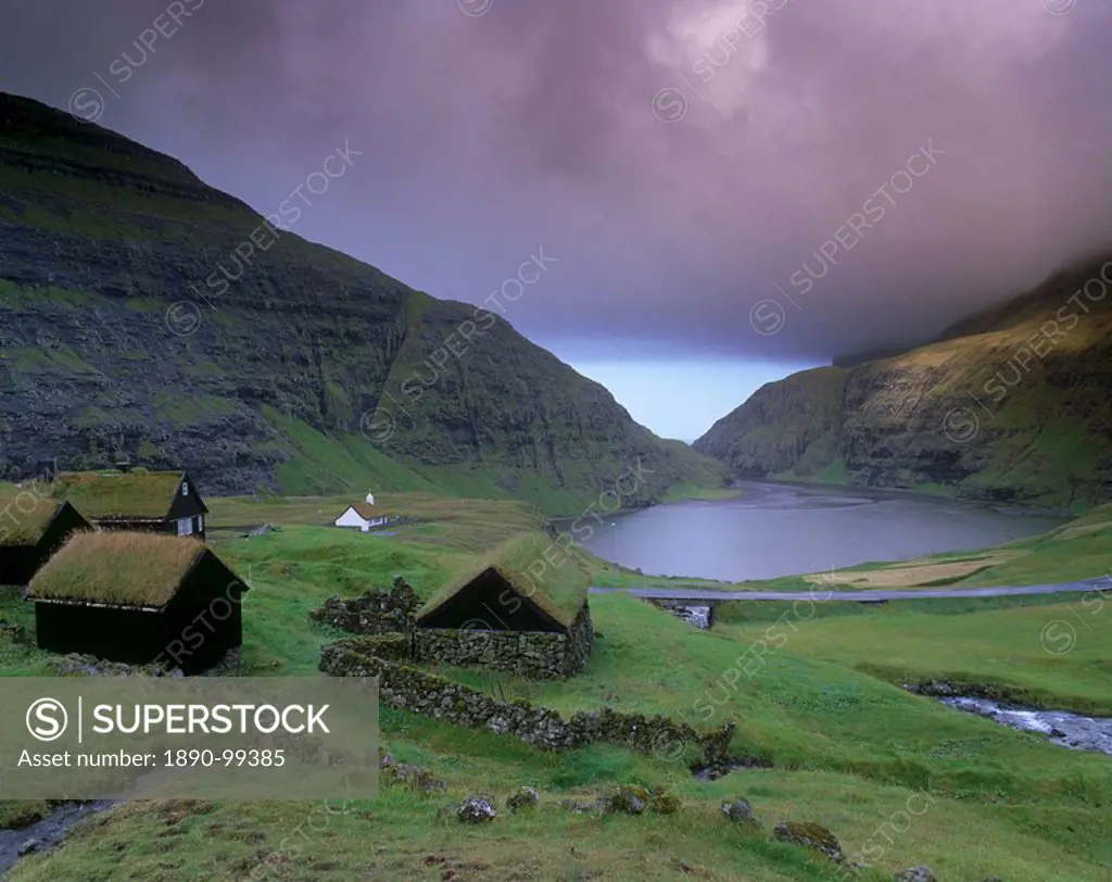 Traditional turf roofed farm buildings and church, Saksun, Streymoy Island, Faroe Islands Faroes, Denmark, Europe