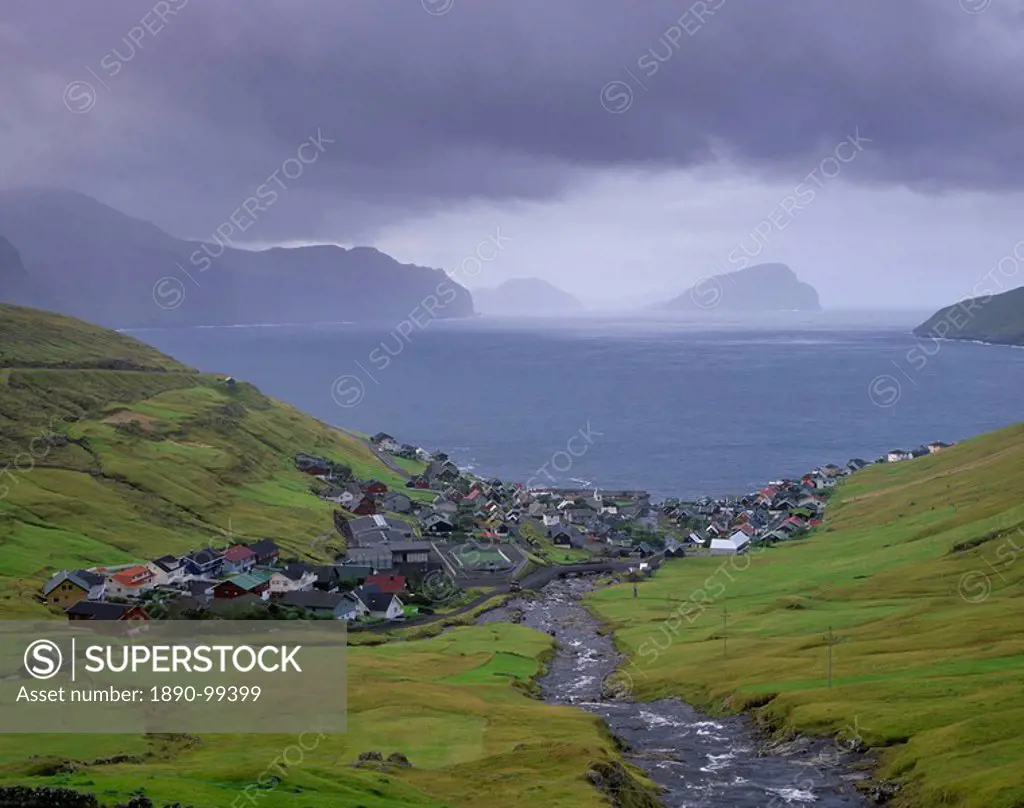 Village of Kvivik and Stora river, view on Vestmannasund, Streymoy coastline, Koltur and Hestur in the distance, Streymoy, Faroe Islands Faroes, Denma...