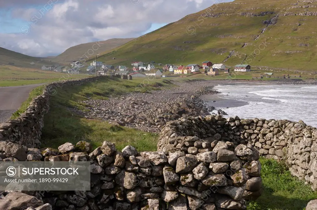 Dry stone walls and village of Husavik, Sandoy, Faroe Islands Faroes, Denmark, Europe