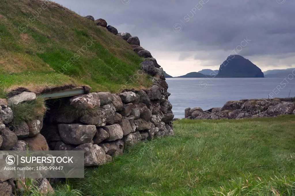 Old fisherman hut and Koltur island, from Kirkjubour, Streymoy, Faroe Islands Faroes, Denmark, Europe, Europe