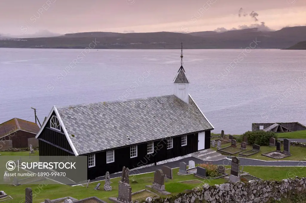 Wooden church at Nes dating from 1843, view across Tangafjordur towards Streymoy, Eysturoy Island, Faroe Islands Faroes, Denmark, Europe
