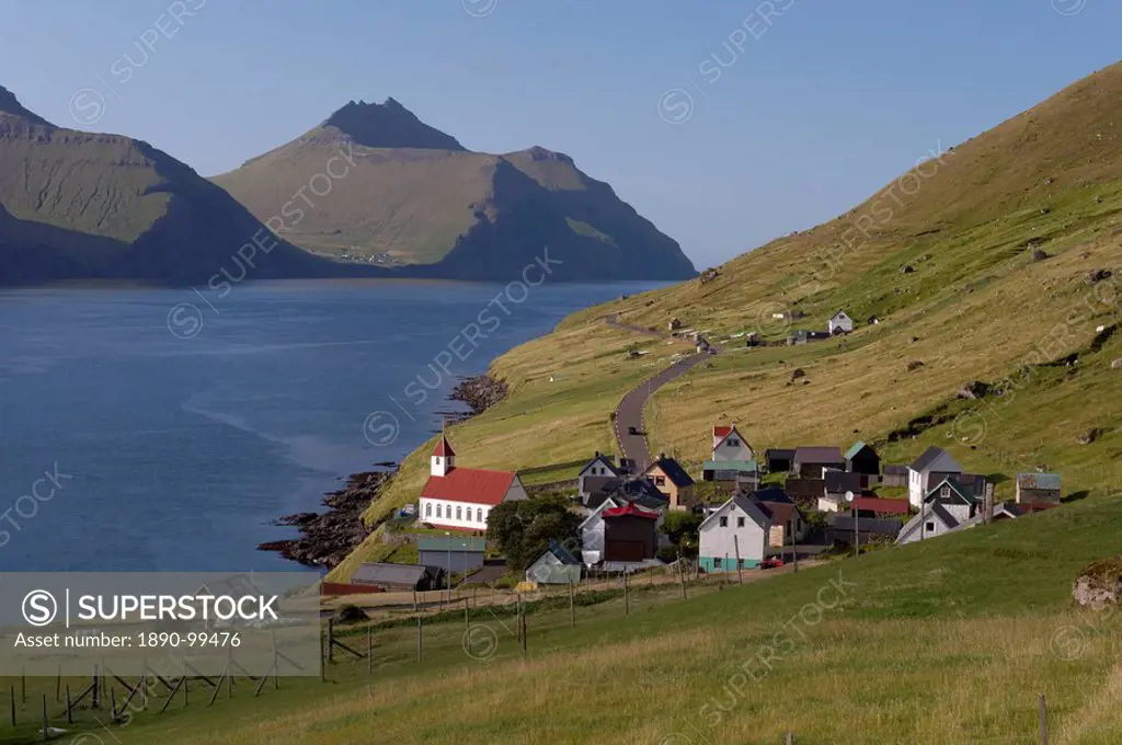 Village of Kunoy, located on the west coast of the island Kunoy, impressively surrounded by high mountains, Kunoy Island, Nordoyar, Faroe Islands Faro...