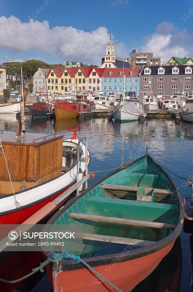 Colourful boats and picturesque gabled buildings along the quayside in Vestaravag harbour, Torshavn, Streymoy, Faroe Islands Faroes, Denmark, Europe.
