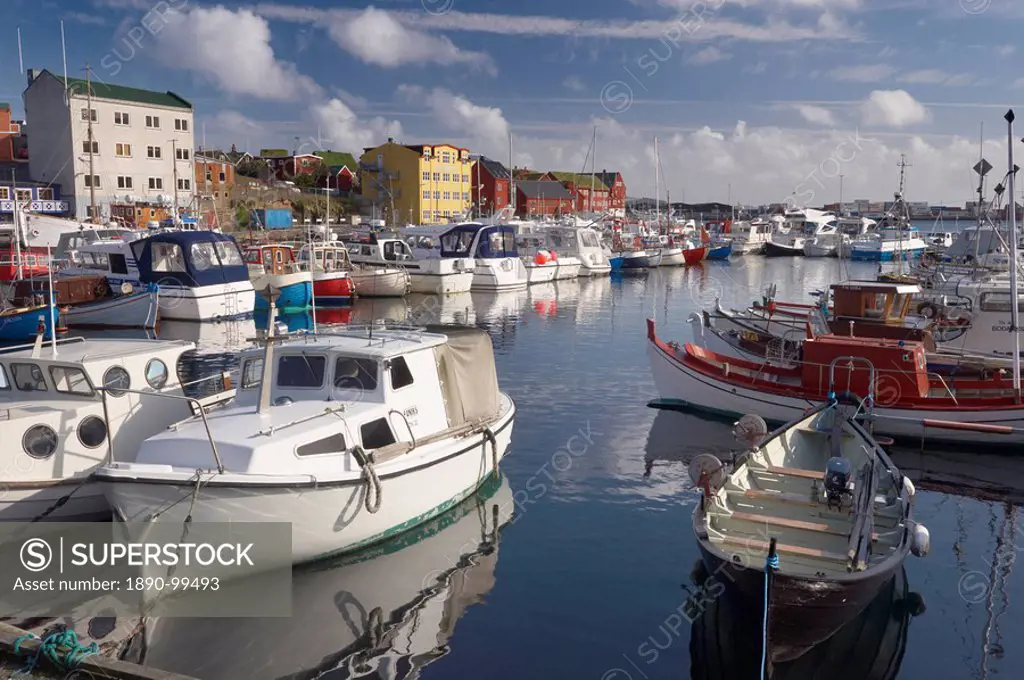 Colourful boats and picturesque gabled buildings along the quayside in Vestaravag harbour, Torshavn, Streymoy, Faroe Islands Faroes, Denmark, Europe