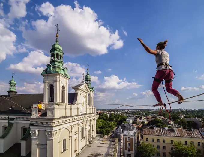 Highlining with Cathedral in the background, Urban Highline Festival, Lublin, Lublin Voivodeship, Poland, Europe