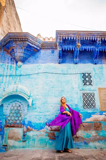Laura Grier stands in the blue streets of Jodhpur, the Blue City, Rajasthan, India, Asia