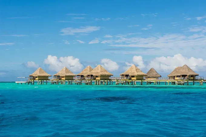 Overwater bungalows in luxury hotel in Bora Bora, Society Islands, French Polynesia, Pacific
