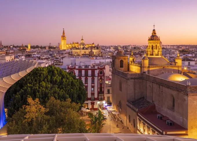 Sunset Seville skyline of Cathedral and city rooftops from the Metropol Parasol, Seville, Andalusia, Spain, Europe