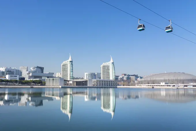 Reflection of Pavilhao de Portugal, Expo 98, with cable car, in Parque das Nacoes (Park of the Nations), Lisbon, Portugal, Europe
