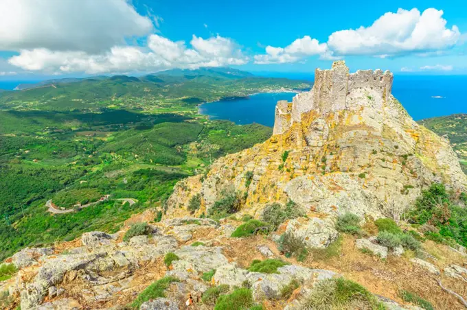 Iconic view from top of Elba mountain of Volterraio Castle on rock at 394 m, Fortress of Volterraio, symbol of Elba Island, dominates Portoferraio Gulf, Tuscan Archipelago, Tuscany, Italy, Europe