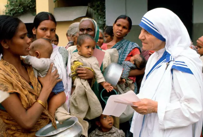 Mother Teresa with mothers and children at her Mission in Calcutta, India