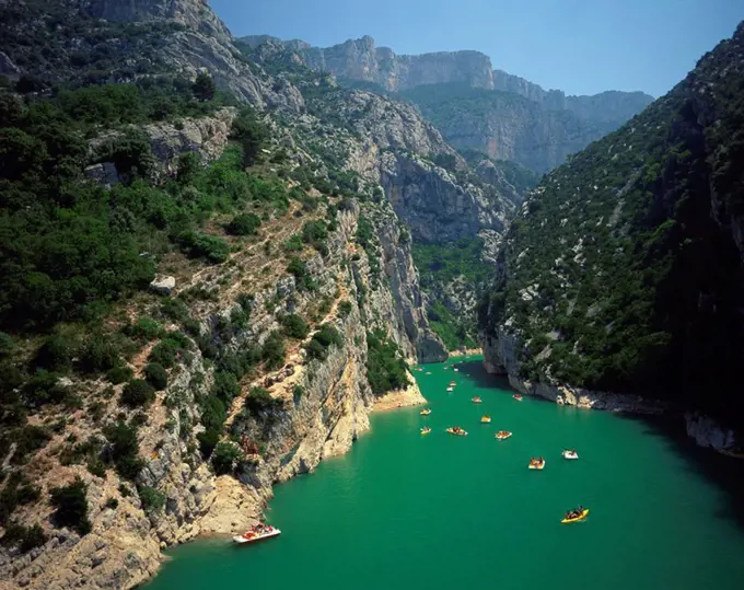 Canoes and pedalos on the River Verdon in the Grand Canyon du Verdon near Lac de Ste Croix, in the Alpes de Haute Provence, Provence, France, Europe