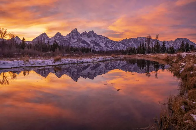 Sunset and reflection of Teton Range in Snake River at Schwabacher's Landing, Grand Teton National Park, Wyoming, United States of America, North America