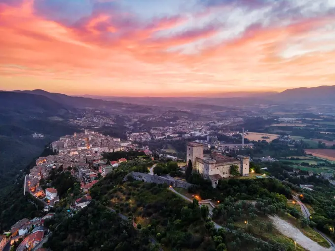 Cityscape of Narni at sunrise, with the fortress at the front and the old town beyond, Narni, Umbria, Italy, Europe