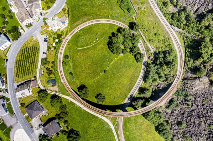 Aerial of the Brusio spiral viaduct, UNESCO World Heritage Site, Rhaetian Railway, Switzerland, Europe
