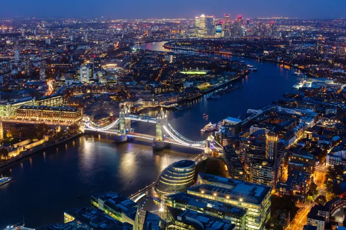 River Thames, Tower Bridge and Canary Wharf from above at dusk, London, England, United Kingdom, Europe