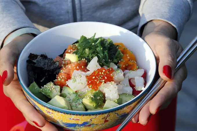 Asian cuisine, fish poke bowl with seaweed, avocado, cucumber, radish, sesame seeds, Haute-Savoie, France, Europe