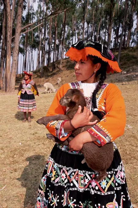 Portrait of a local Peruvian young woman in traditional dress, Cuzco Cusco, Peru, South America