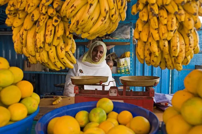 Woman selling fruit in a market stall in Gonder, Gonder, Ethiopia, Africa