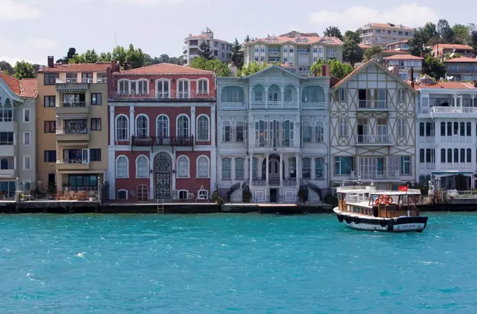 The restored waterfront buildings of Yenikoy on the Bosphorus, Istanbul, Turkey, Europe